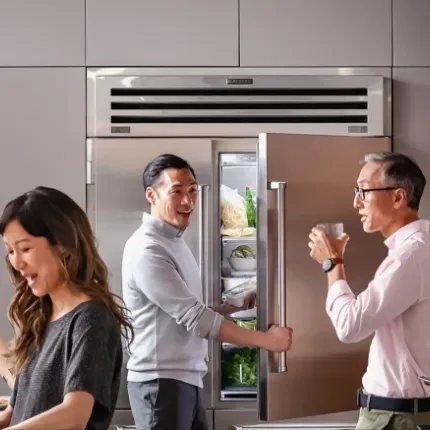 family in front of subzero refrigerator